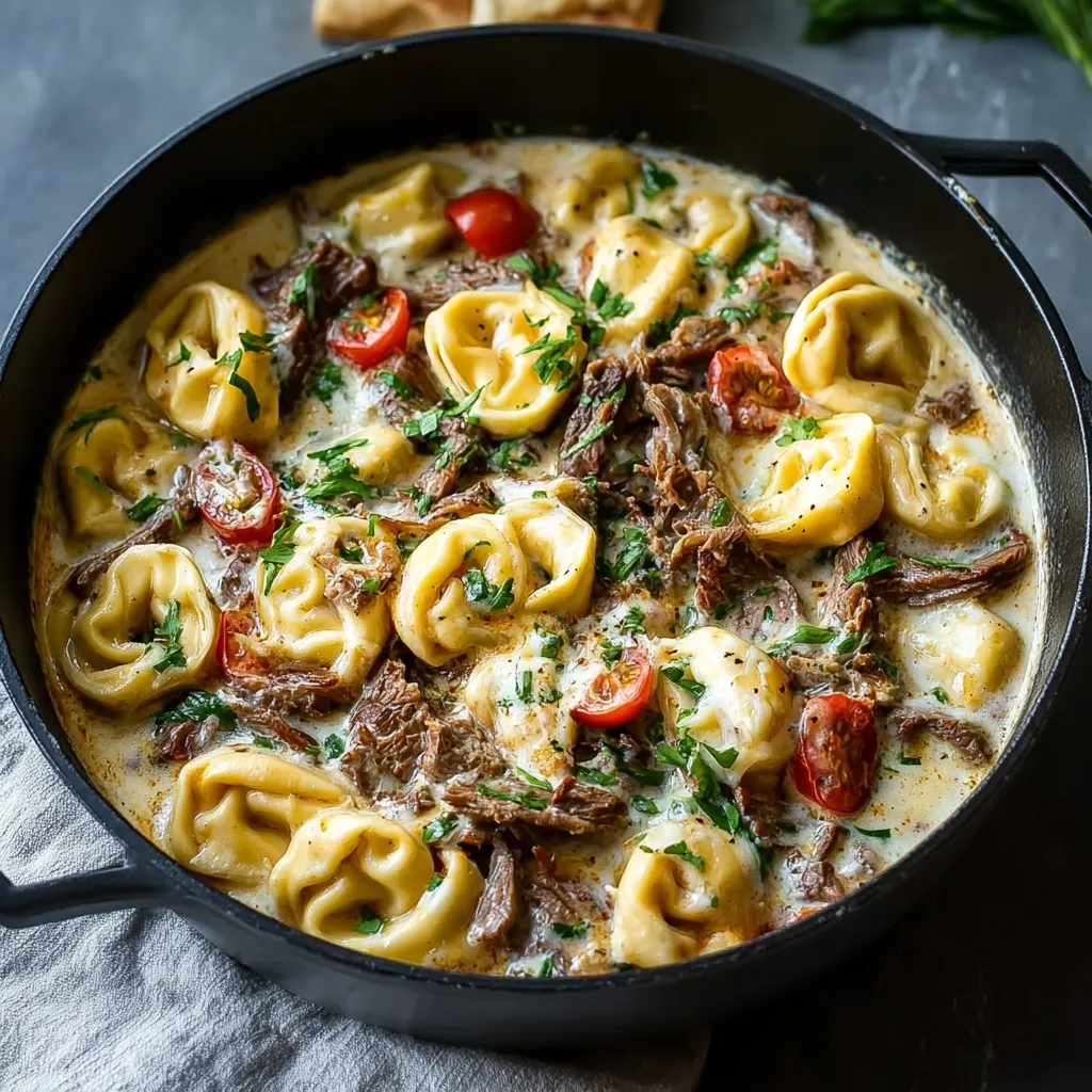 Close-up of delicious Creamy Cheesesteak Tortellini, showcasing the creamy sauce and savory filling.